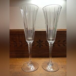 2 Crystal  Champagne Flutes. Vertical cut, detailed stem. 9” high.